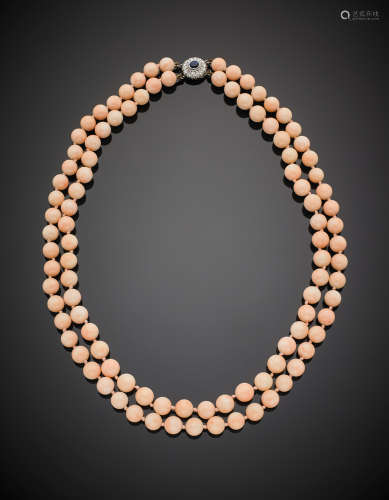 Two-strand pink coral bead necklace with white gold diamond and sapphire clasp, g 121.00, length cm 56 circa.