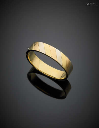 Tri coloured gold adjustable cuff bracelet, g 31.70, diam. cm 5.90.
