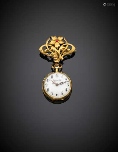 Yellow gold flower pin and watch accented with a diamond and a ruby, g 15.32.
