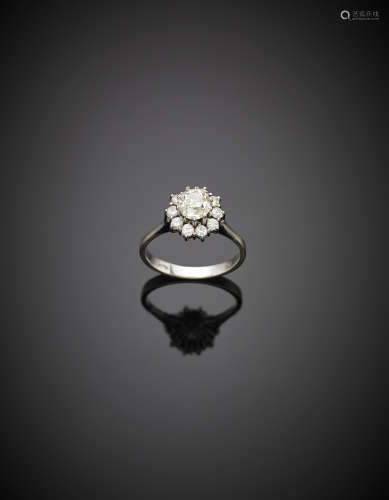 White gold ring centered by a round old mine cut diamond ct. 0.85 circa, g 3.90 size 15/55.