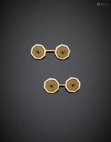 Yellow polished and interlaced gold cabochon sapphire octagonal cufflinks g 4.80. Inscribed 4.11.37 in the back