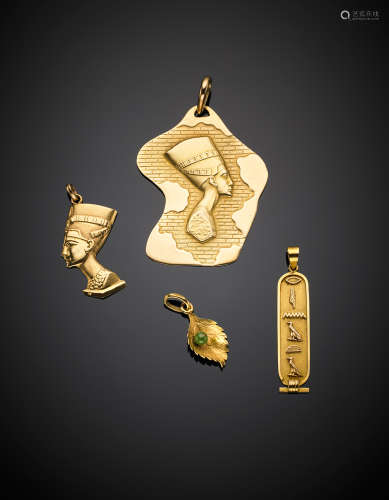 Yellow gold lot comprising three Egyptian pendant and a small green gem set leaf pendants, g 19.02.