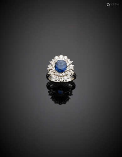 White gold, round and marquise diamond ring centered by a ct. 2.20 circa oval sapphire, g 6.79 size 12/52.