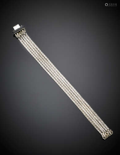 White partly glazed gold sapphire accented five strand bracelet, g 37.57, length cm 19.30, h cm 2 circa.