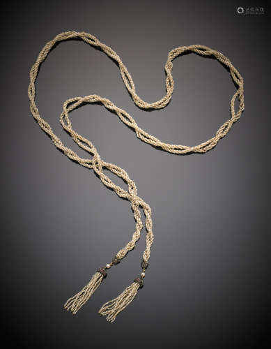 Woven natural seed pearl rope sautoir, ending with silver, diamond and ruby cup tassels, g 34.80, length cm 115 circa.