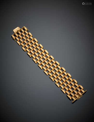 Yellow partly glazed gold modular articulated bracelet, g 72.60, length cm 19.50, h cm 3.70 circa.