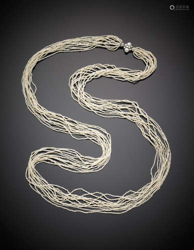Twelve strand seed-pearl necklace with a huit-huit diamond and pearl clasp, g 45.21, length cm 104 circa.