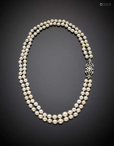 Two strand white graduated cultured pearl necklace with white gold diamond clasp, in all ct. 1.50 circa, in all g 83.50, length cm 54 circa. Diam. pearl from mm 6.50 to mm 10.00