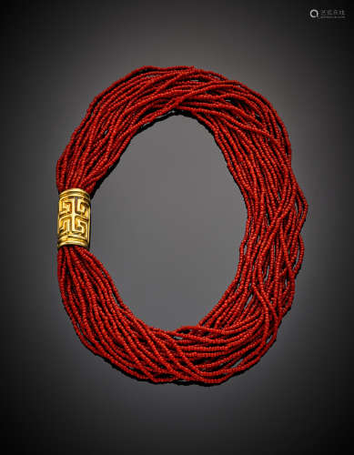 Multi-strand red coral necklace with wrought yellow gold clasp, g 89.79, length cm 51.00 circa.