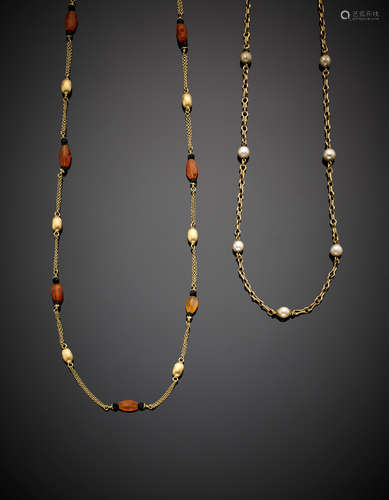 Two yellow gold long chain necklaces with carnelian the first and pearls the second, in all g 51.21.