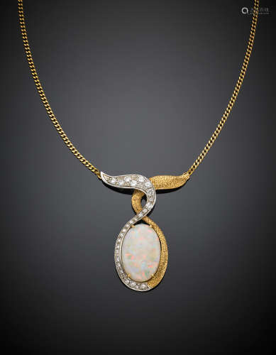 Bi coloured gold chain with an oval cabochon opal mm 21,20 x 14,50 pendant accented with huit huit diamonds, g 14.7, length cm 38.50 circa.