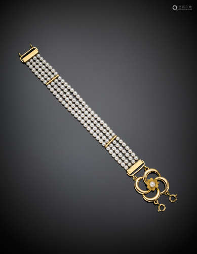 SAFOFour strand white cultured mm4 pearl bracelet with yellow partly glazed gold clasp, g 24.24, length cm 19 circa.