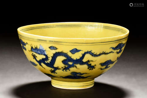 A RARE YELLOW-GROUND UNDERGLAZE BLUE 'DRAGON' BOWL