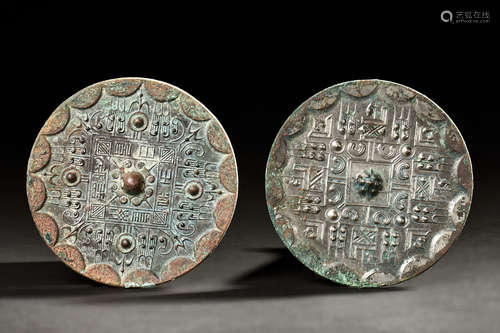 TWO ARCHAIC BRONZE CAST MIRRORS