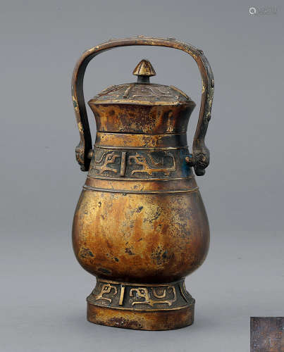 清康熙 铜鎏金饕餮纹提梁壶瓶