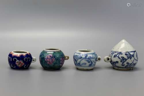 Group of four Chinese porcelain bird feeders