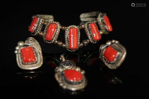 Set of sterling silver and red coral jewelry.