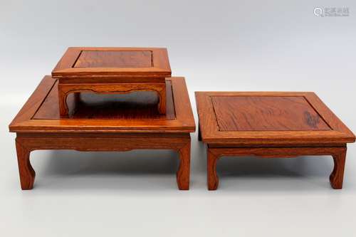 Set of three Chinese Huanghuali wood stands.