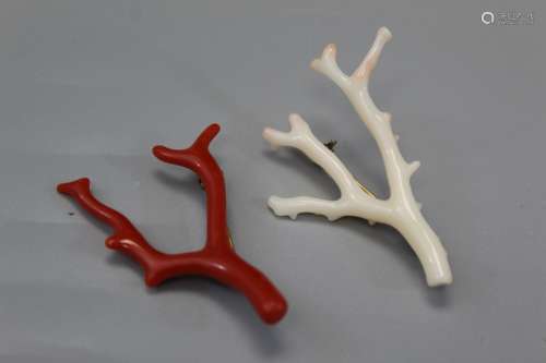 Two coral brooches.
