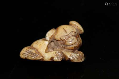 Japanese carved jade netsuke of a puppy.