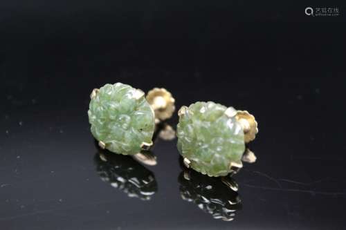 14K gold green jade earrings.