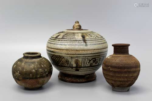 Group of Southeast Asian pottery pieces.