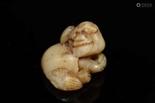 Japanese carved jade netsuke of a dog.