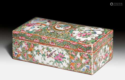 A CANTON YELLOW GROUND LIDDED BOX WITH FLORAL CARTOUCHES. China, 19th c. 7x9.5x19.3 cm.