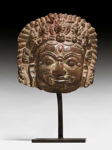 A COPPER REPOUSSE MASK OF BHAIRAVA.