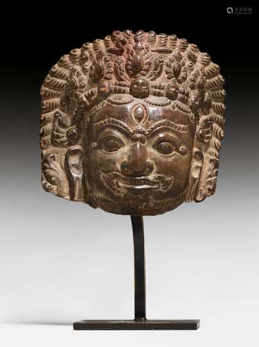 A COPPER REPOUSSE MASK OF BHAIRAVA.
