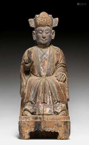 A WOODEN FIGURE OF A SEATED CELESTIAL OFFICIAL. China, Qing Dynasty, H 36 cm. Traces of paint. Minor damage.