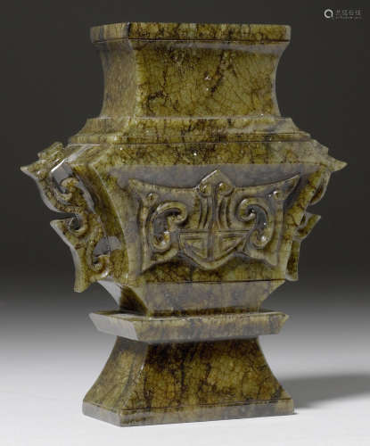 A RECTANGULAR JADE VASE CARVED WITH BATS AND OPENWORK CHILONG HANDLES. China, Republican Period, H 15.5 cm. Minor chips.