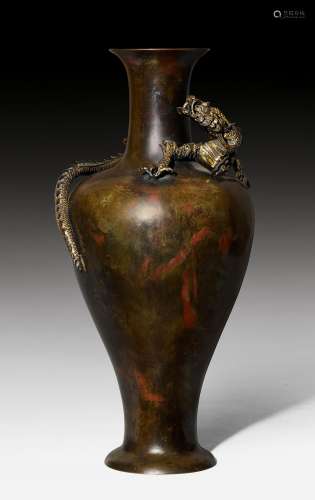 A DARK RED PATINATED BRONZE VASE WITH A GILT DRAGON IN HIGH RELIEF AROUND THE SHOULDER. Japan, Meiji Period, H 45.5 cm. Mark in the foot.