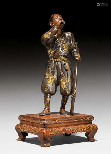 A FINE BRONZE HUNTER BLOWING A WHISTLE BY THE MIYAO WORKSHOP.