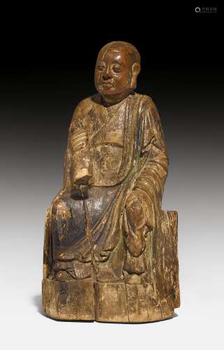 A FINE WOOD SCULPTURE OF A SEATED MONK.