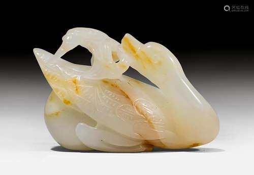 A FINELY CARVED JADE DUCK.