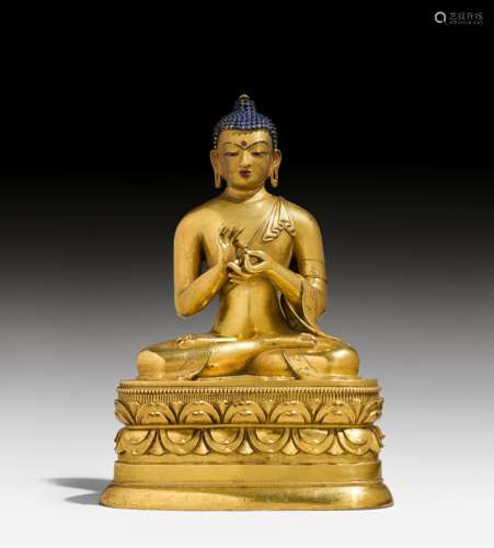 A GILT BRONZE FIGURE OF BUDDHA VAIROCANA.