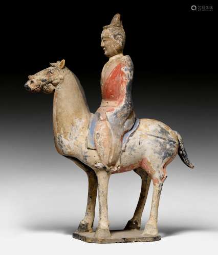 A PAINTED POTTERY FIGURE OF AN EQUESTRIAN.