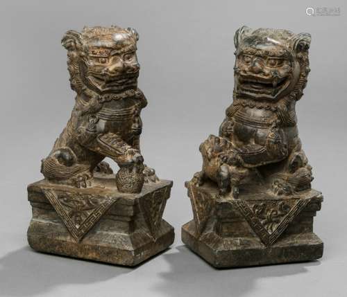 A PAIR OF BUDDHIST STONE LIONS