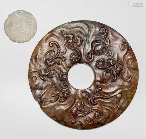 A CARVED JADE BI DISK WITH NINE CHILONG AND A CARVED DRAGON PENDANT