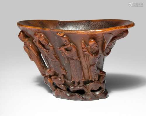 A FINE AND VERY RARE RHINOCEROS HORN 'SHOULAO AND EIGHT IMMORTALS' LIBATION CUP