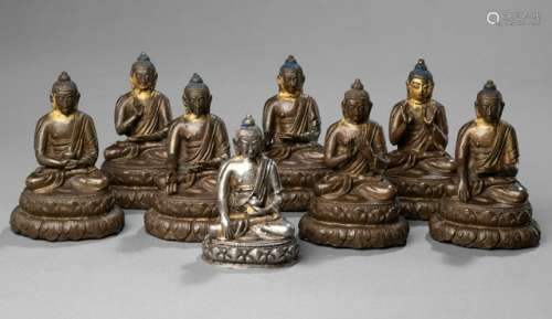 SEVEN BRONZE FIGURES OF THE BHAISAJYAGURU AND A SILVER FIGURE OF BUDDHA SHAKYAMUNI