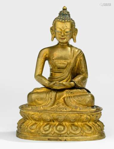 A GILT-COPPER EMBOSSED FIGURE OF BUDDHA SHAKYAMUNI