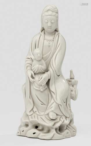 A DEHUA MODEL OF SEATED GUANYIN WITH BOY