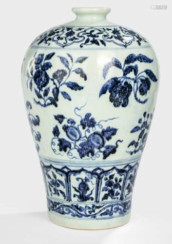 A BLUE AND WHITE VASE WITH FRUIT SPRAYS