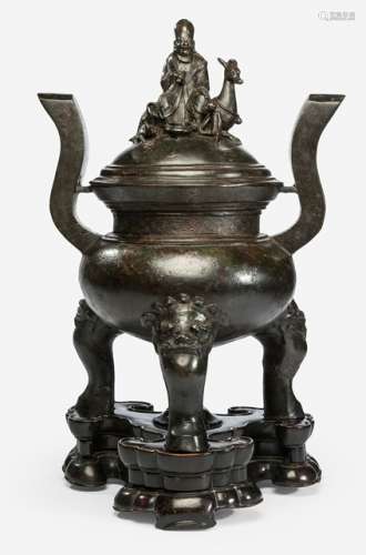 A LARGE DING-SHAPED BRONZE CENSER AND COVER WITH SHOULAO FINIAL ON CARVED HARDWOOD STAND