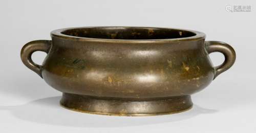 A BRONZE CENSER WITH TWO HANDLES