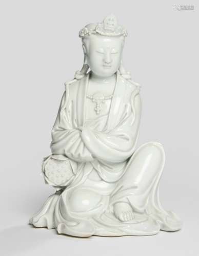 A DEHUA MODEL OF SEATED GUANYIN WITH LOTUS