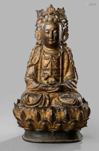 A GILT-LACQUERED BRONZE FIGURE OF GUANYIN SEATED ON A LOTOS