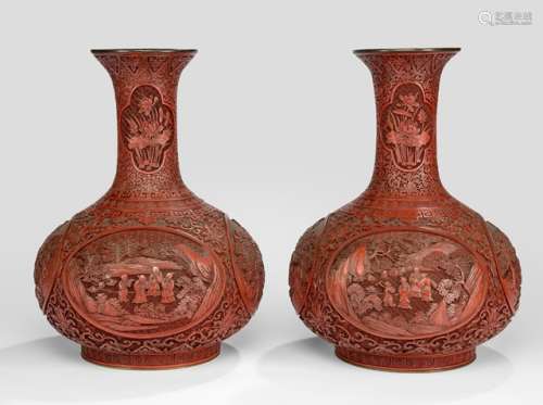 A FINE CARVED PAIR OF CINNABAR LACQUER VASES WITH IMMORTALS AND LOTOS